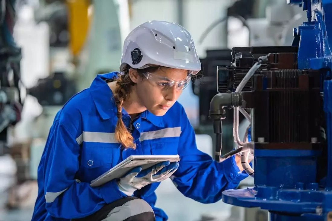 Engineer inspecting equipment in a research and testing lab