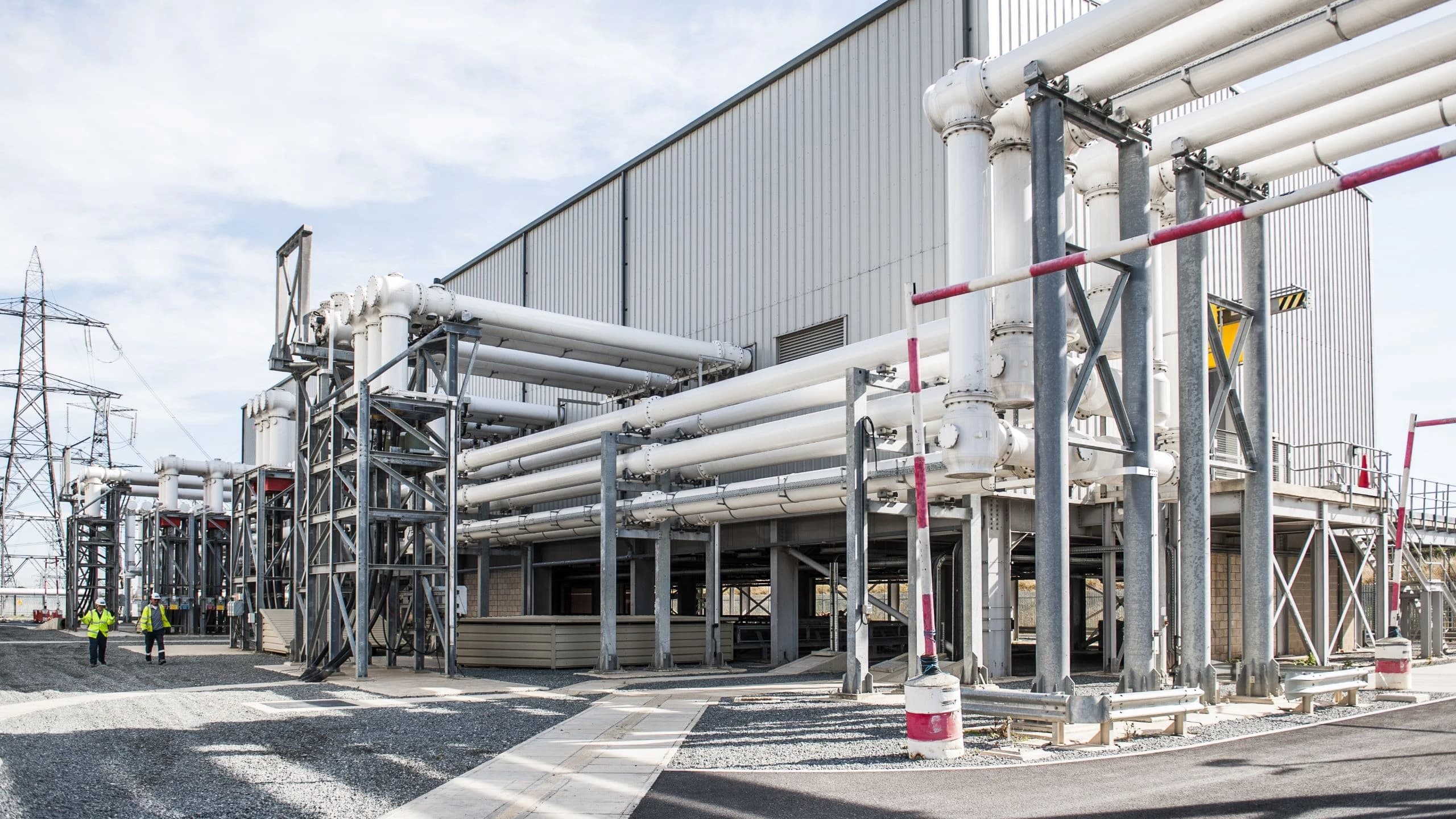 Energy infrastructure facility with piping systems