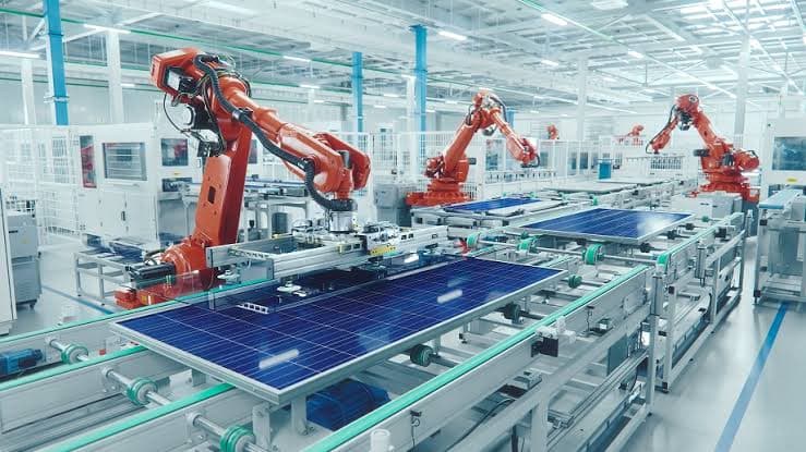 Robotic arms on an industrial automation line